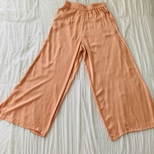 Light coral satin wide leg pants.